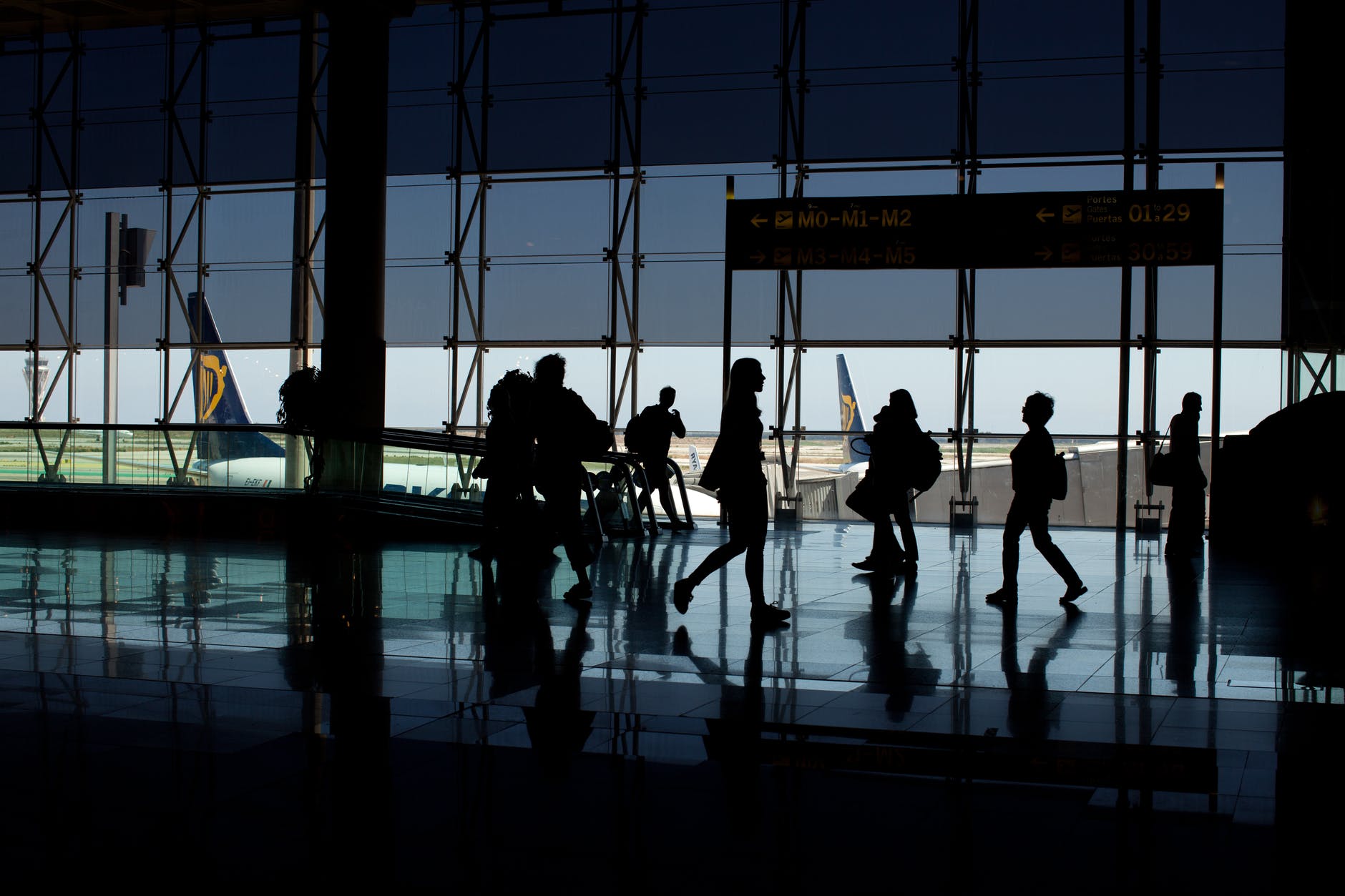 silhouette of people at the airport